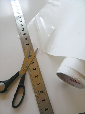 1. Cut the clear mounting sheet to the size you need for your backsplash. (We used Mosaic Mount, available at craft stores or stained glass suppliers. It is a flexible transparent sheet that sits on the face of the tile as you install it and is removed after the tile is set into place and the mastic has dried). Pieces larger than 12-inches square are hard to handle once the nuggets are attached, so you may want to make your backsplash or border in several pieces.